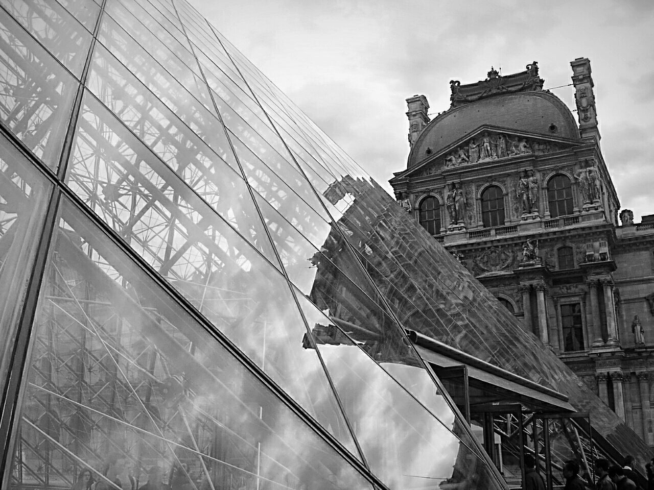 architecture, low angle view, built structure, building exterior, sky, city, reflection, cloud - sky, cloud, tall - high, outdoors, day, modern, skyscraper, office building, tall, capital cities, no people, history