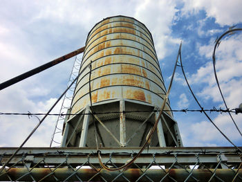 Low angle view of water tower against sky