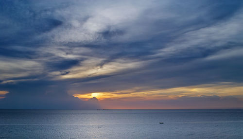 Scenic view of sea against sky at sunset