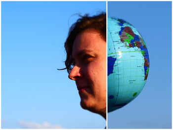 Portrait of man against blue sky