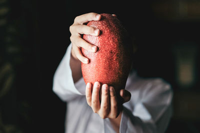 Man holding fruit