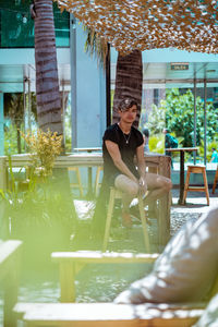 Woman sitting on chair at restaurant