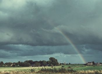 Scenic view of rainbow over field