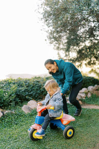 Boy playing with toy on field