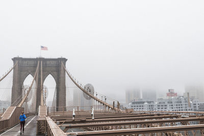 Bridge against sky in city