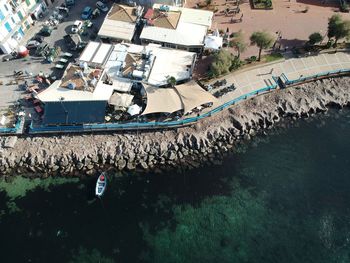 High angle view of people on river in city