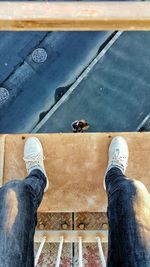 Low section of person standing on ground