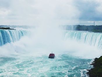 Scenic view of ferry boat sailing niagara falls 