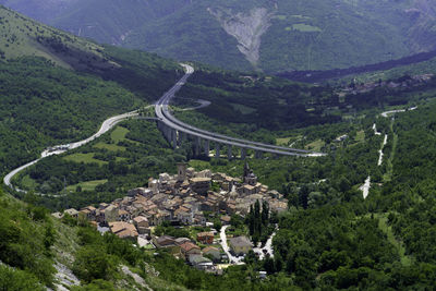 High angle view of trees and mountains against sky