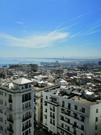 High angle view of buildings in city against sky