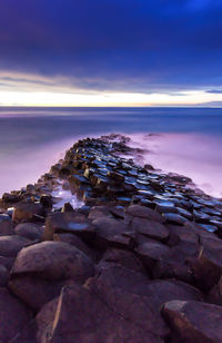 Scenic view of sea against sky at sunset