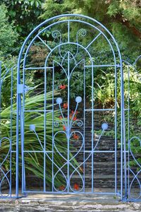 Metal gate against trees