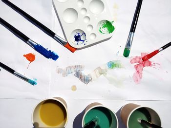 High angle view of paintbrushes on table