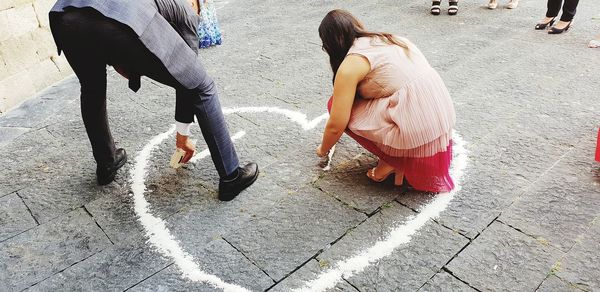 High angle view of people walking on footpath