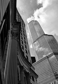 Low angle view of modern buildings against sky in city