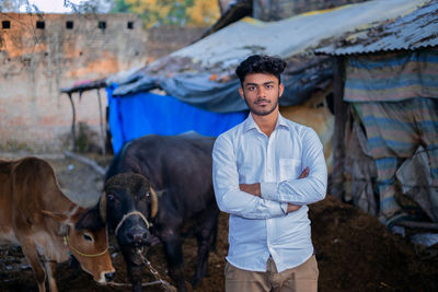 Portrait of young man standing outdoors