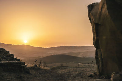 Scenic view of landscape against sky during sunset