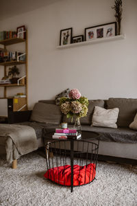 Flower vase on table at home