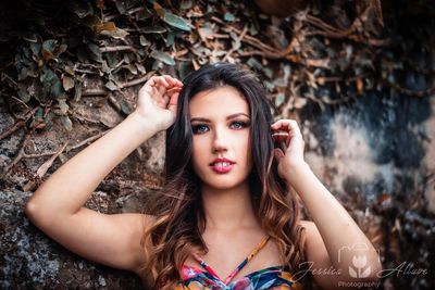 Portrait of beautiful young woman in park