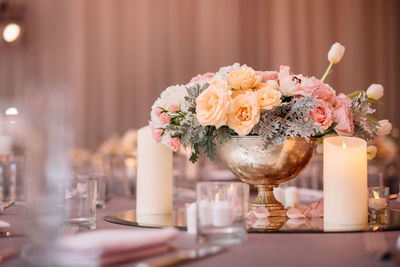 Close-up of roses in vase on table