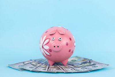 Close-up of pink umbrella against blue background