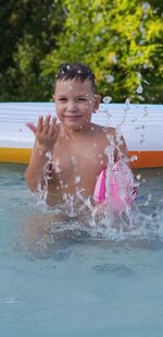Portrait of boy in swimming pool