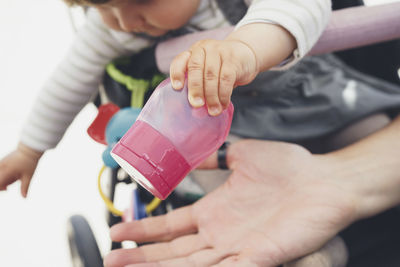 Close-up of woman playing with toy