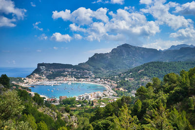 Panoramic shot of townscape by sea against sky