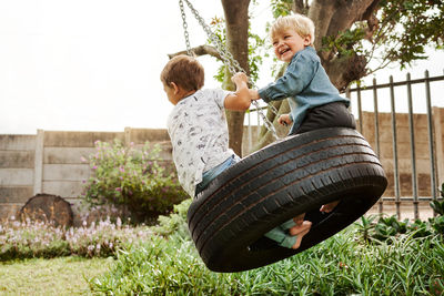 Kids enjoying swing at park