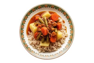 Directly above shot of food in plate on white background