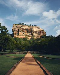 View of lion's rock against cloudy sky in sri lanka