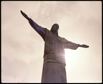 Low angle view of statue against sky