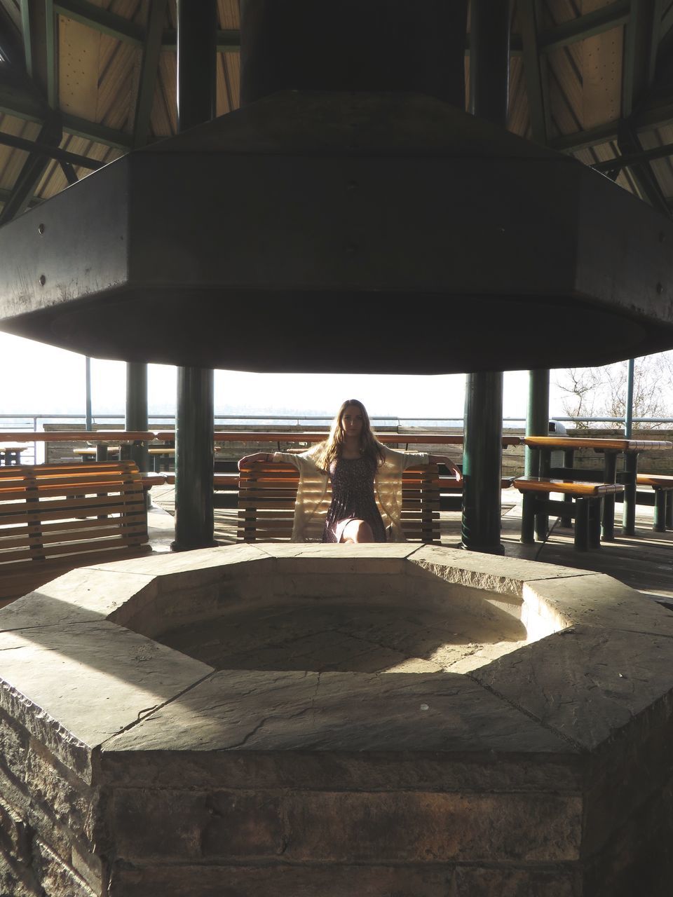 built structure, lifestyles, real people, architecture, sunlight, architectural column, day, outdoors, men, women, sky, city, one person, bridge - man made structure, people