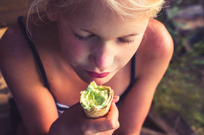 Close-up of teenage girl holding ice cream