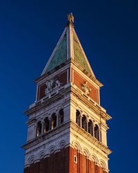 Low angle view of a building against blue sky