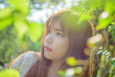 Portrait of young woman outdoors