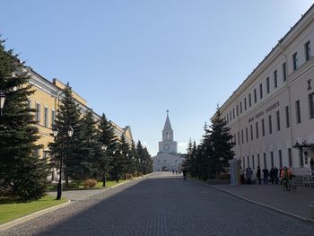 Street amidst buildings against sky in city