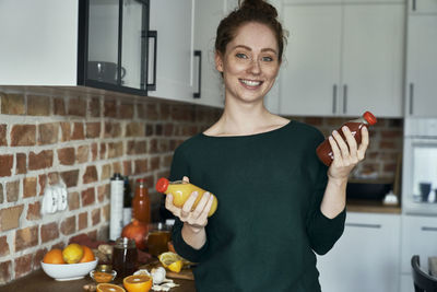 Portrait of young woman using mobile phone