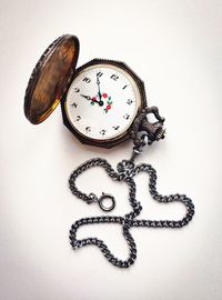 Close-up of clock against white background