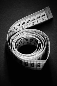 Close-up of tape measure on table