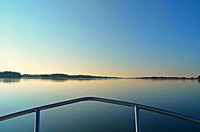 Scenic view of calm sea against clear sky