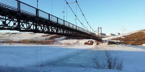 View of suspension bridge during winter