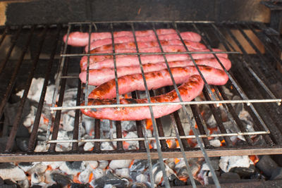 High angle view of meat on barbecue grill