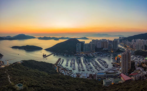 Panoramic aerial view of a stunning sunset over aberdeen and ap lei chau district of hong kong