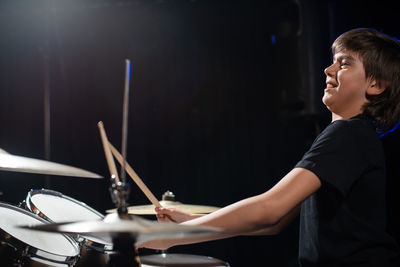 Young man playing drum