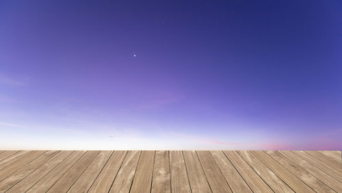 Scenic view of moon against clear blue sky