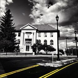 City street against cloudy sky