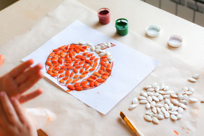 High angle view of person preparing food on table