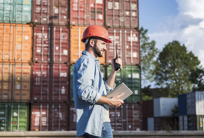 Side view of man working at construction site