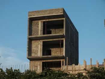 Low angle view of building against clear blue sky